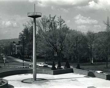 A view of Memorial Plaza looking down south on University Avenue.  Mast belongs to battleship West Virginia which was sunk at Pearl Harbor.
