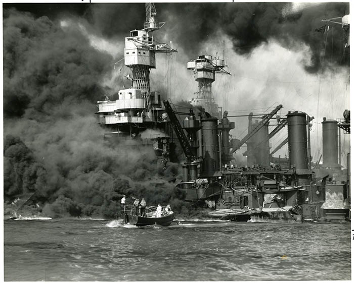 Crew rescuing men of the USS <em>West Virginia</em> during the attack on Pearl Harbor, December 7, 1941.