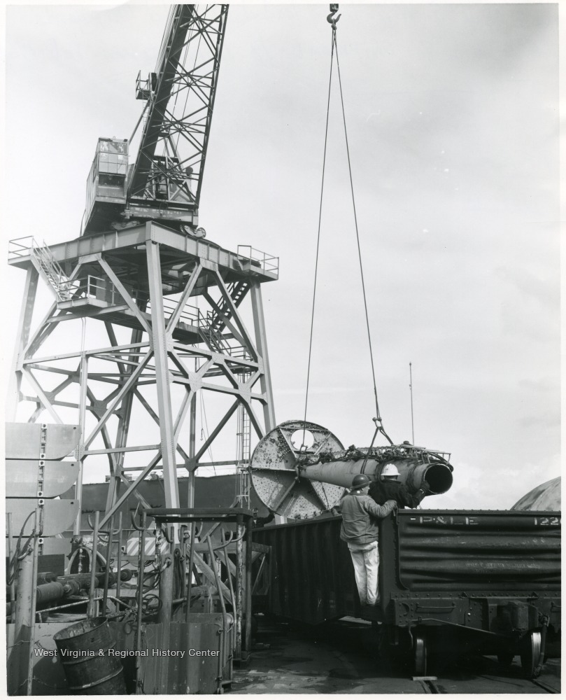 Mast of U.S.S. West Virginia being loaded at Todd Shipyards in Seattle, Washington for shipment to Morgantown in February 1961.