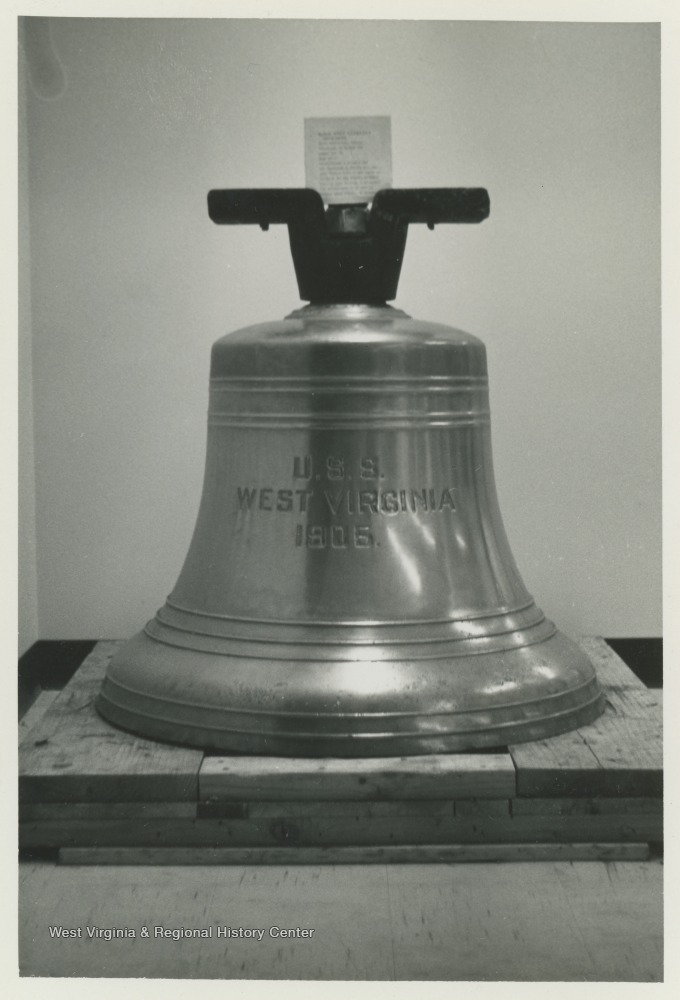 Bell of the U.S.S. West Virginia before installation on the campus of West Virginia University.  The bell was dedicated on December 7, 1967, and joined the mast of the U.S.S. West Virginia in Memorial Plaza.